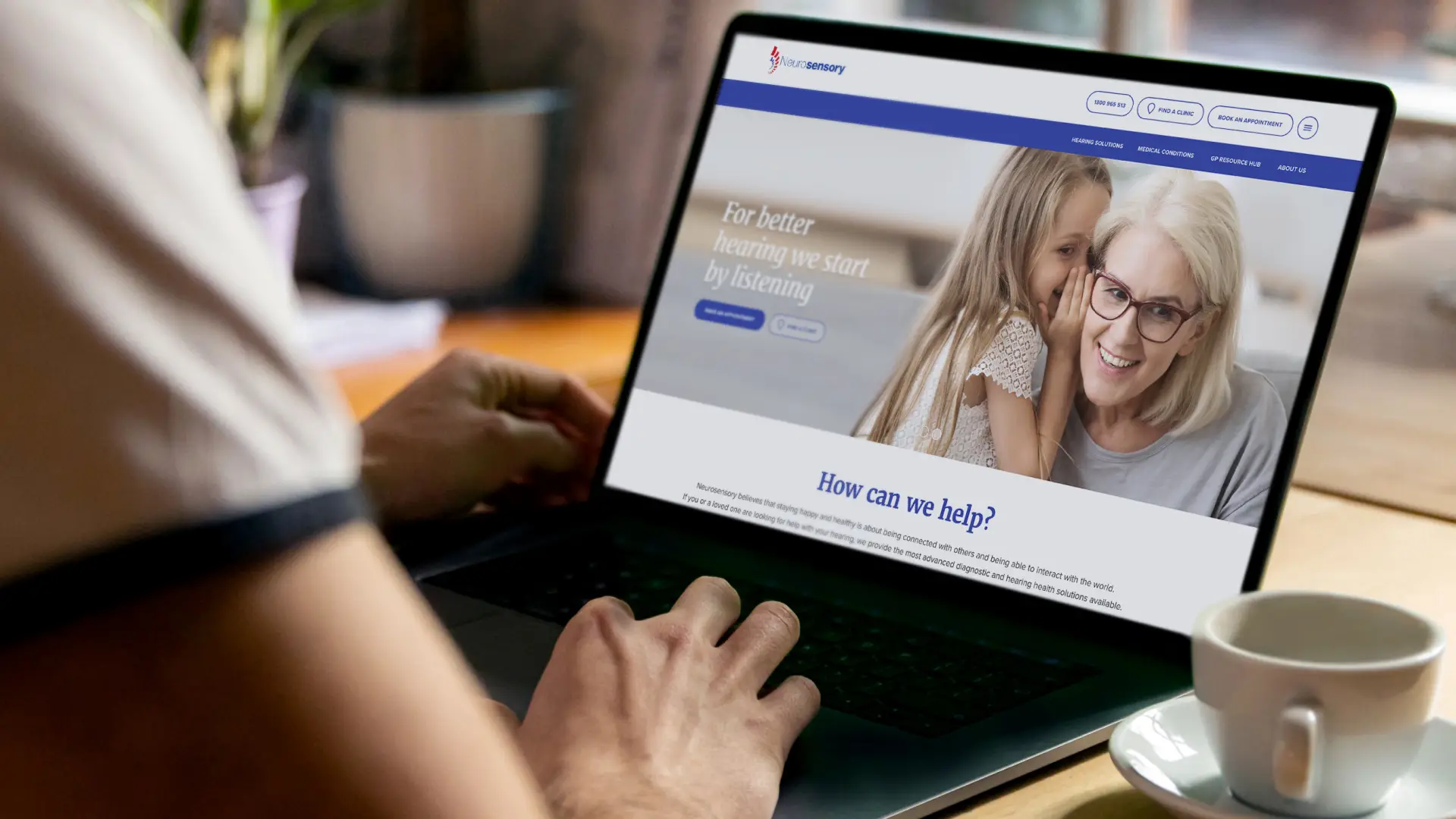Neurosensory homepage on a laptop, showing the hearing health hero and main navigation
